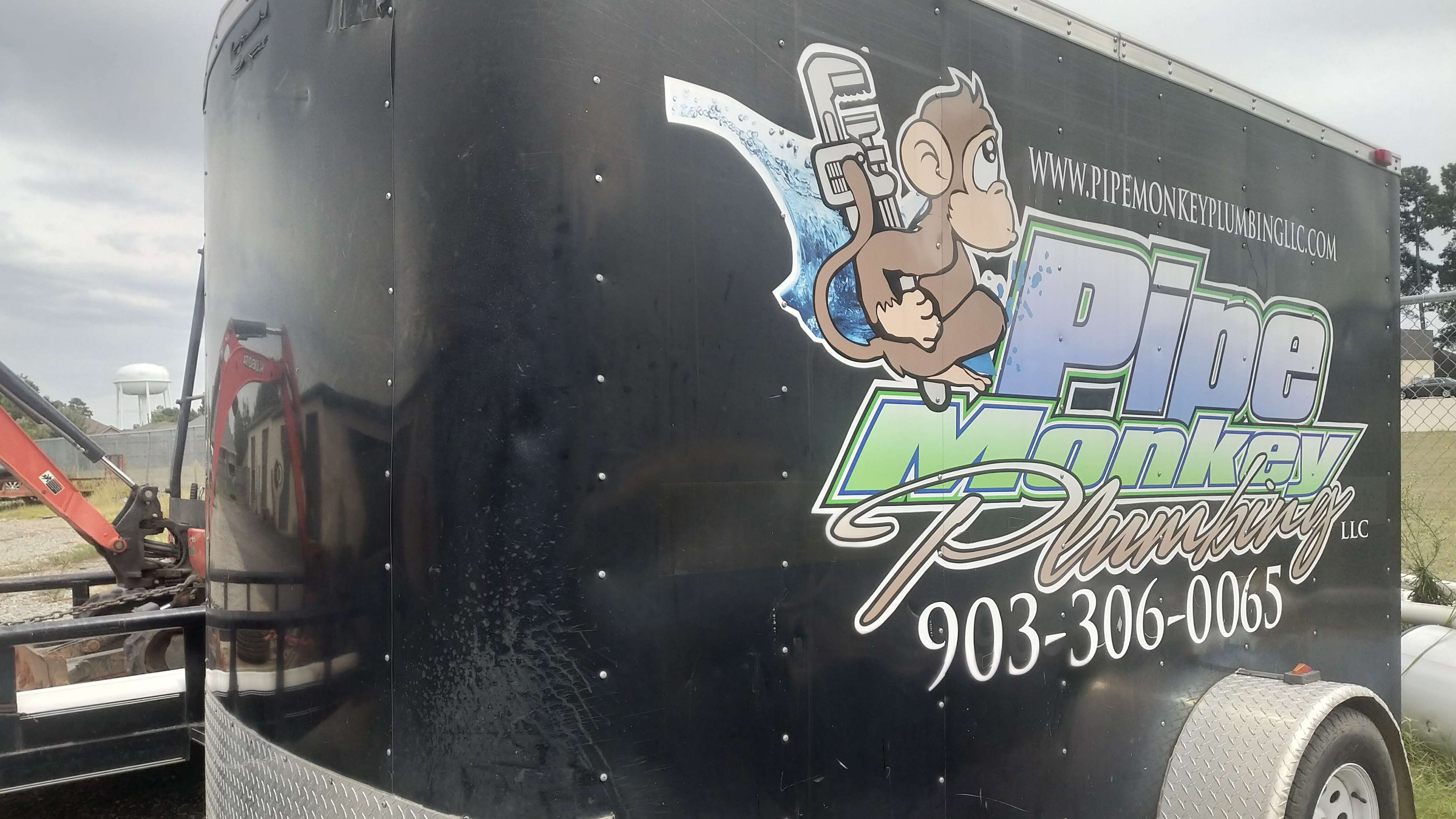 pipe monkey logo on a trailer
